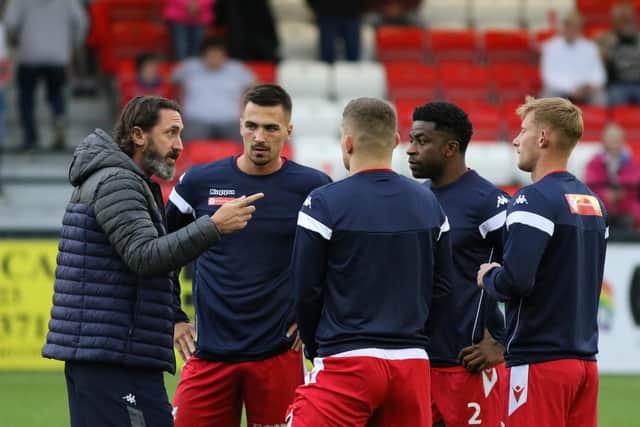 Scarborough Athletic boss Jono Greening gives his players instructions before a game at the Flamingo Land Stadium.