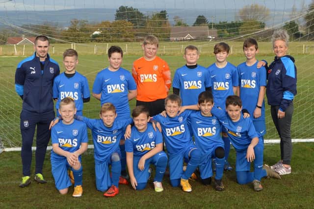 Heslerton U11s show off their new team kit.