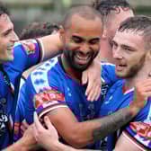 Whitby Town scorer Jacob Hazel, centre, hit a hat-trick in last weekend's 5-0 FA Trophy win against Mossley.