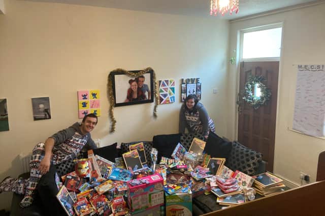 Joe and Courtney with some of the toys they collected in 2020