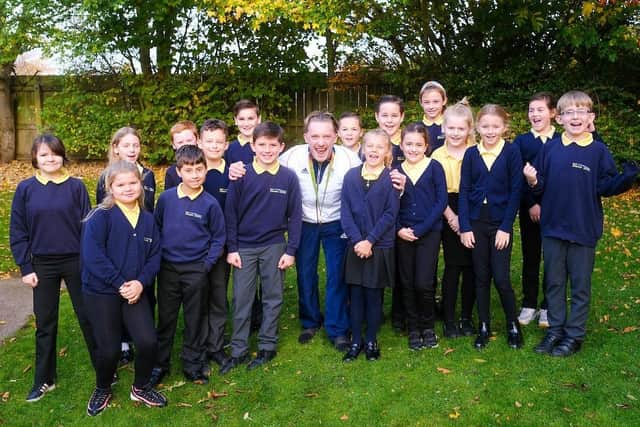 GB Gymnast Nile Wilson is pictured with Bay Primary School pupils. Photo by Tony Bartholomew