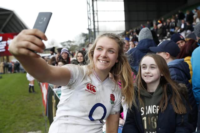 Zoe Aldcroft of England interacts with fans after the Women's Six Nations match between England and Wales at Twickenham Stoop.