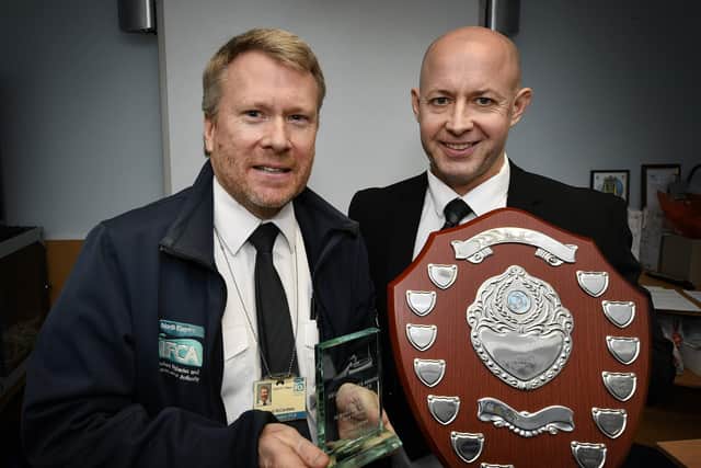 Whitby & District Fishing Industry Training School director Andy Hodgson accepts the George Traves Award from David McCandless, on behalf of absent winner Ethan Chown.
215014b