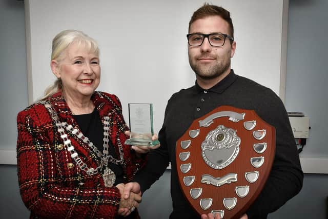 Whitby Mayor Cllr Linda Wild presents Adam Mouncey with his Apprentice of the Year, Workboats award.
215014e