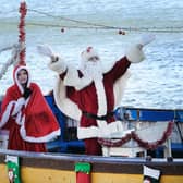 Santa waves to the crowd