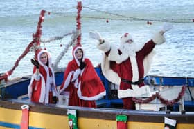 Santa waves to the crowd