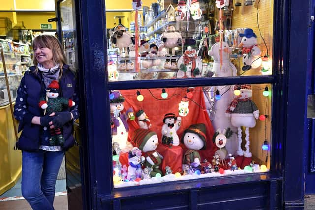Sue White at the door of Falsgrave Pet Shop - one of the businessed taking part in the Christmas window display competition