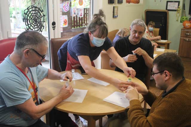 Residents at Kirkgate House take part in the science-based activity.