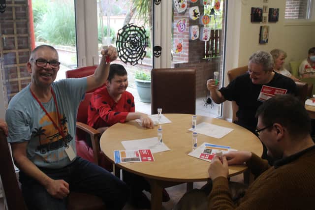 The residents enjoyed the fun project growing a plant in a test tube.
