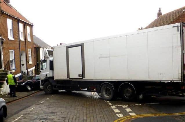 Earlier this year a woman was seriously injured when a runaway lorry crashed into a parked car, pinning her against a wall. (Photo: Dave Barry)