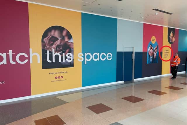 A hint has appeared on temporary construction hoardings at the Brunswick, in front of the former Debenhams unit. (Photo: Brunswick/Scarborough Group)