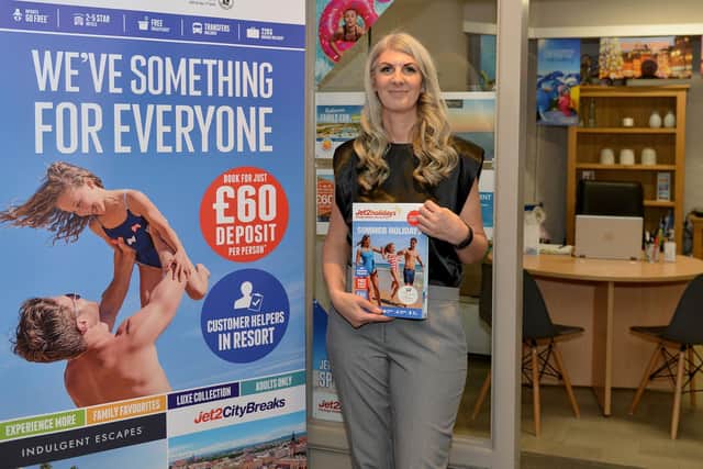 Pebble Shore Travel owner Rachel Dartnall-Smith outside the new shop in Scarborough Market Hall.