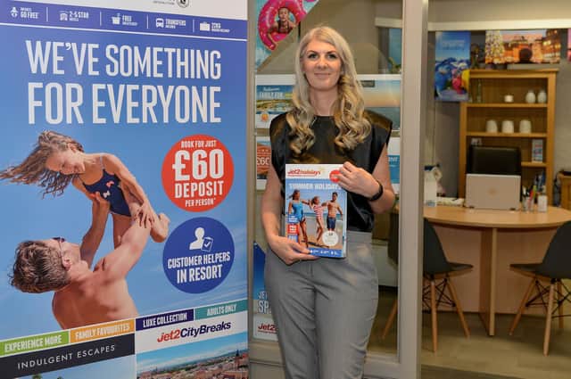 Pebble Shore Travel owner Rachel Dartnall-Smith outside the new shop in Scarborough Market Hall.