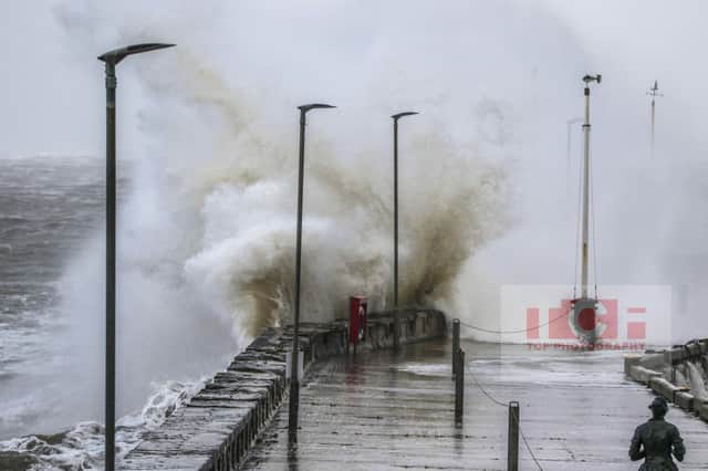 Thomas Flynn sent in this excellent photograph of a wave crashing against the harbour pier during Storm Arwen.