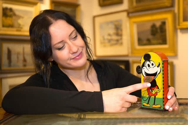 The saleroom's Lauren Reveley with the moneybox