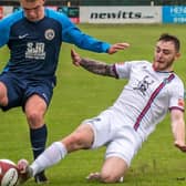Whitby Town's Marcus Giles, white kit, was sent off in the loss to Nantwich in the FA Trophy.