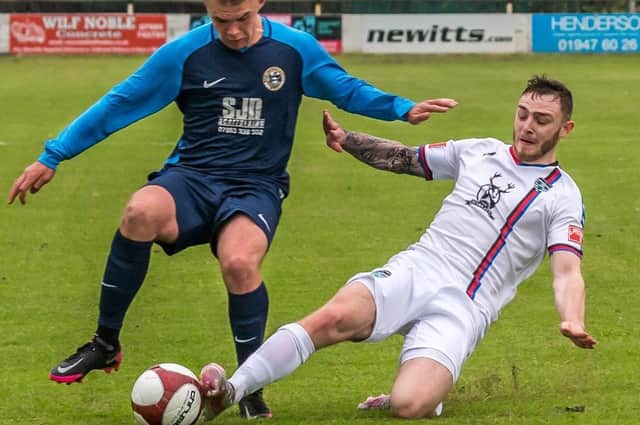 Whitby Town's Marcus Giles, white kit, was sent off in the loss to Nantwich in the FA Trophy.