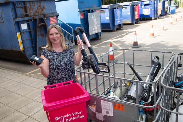 Take out the batteries: service improvement officer Jenny Lowes removes the battery from a vacuum cleaner before recycling it.