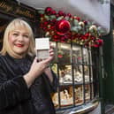 Kay Bradley outside her jewellery store in York with one of the special bracelets she is gifting to NHS workers this Christmas.