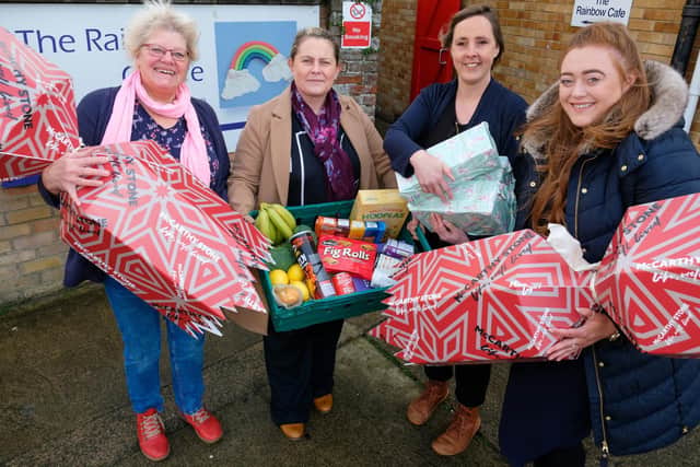 Trish Kinsella from the Rainbow Centre receives the donation