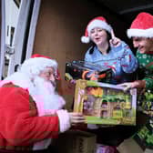 Joe and Courtney Maw delivering some of the toys they collected to the Rainbow Centre