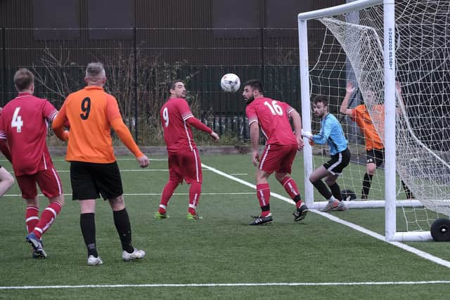 Newlands make a headed clearance during the Scarborough Saturday League Division One 3-1 win against Edgehill at Pindar Leisure Centre on Saturday December 11 2021
Photos by Richard Ponter