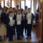 Children and staff from Our Lady and St Peter RC Primary School recently paid a visit to Mallard Court Care Home. Photo courtesy of Mallard Court