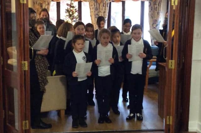 Children and staff from Our Lady and St Peter RC Primary School recently paid a visit to Mallard Court Care Home. Photo courtesy of Mallard Court