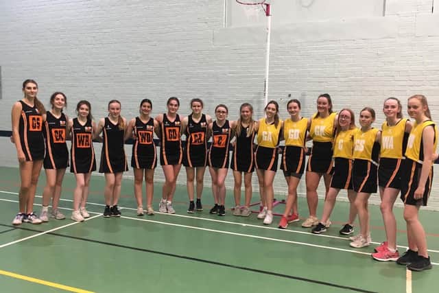 The Sharks and Piranhas line up before their Scarborough Netball League match.