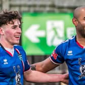 Jacob Hazel, right, celebrates his - and his team's - opening goal as Whitby Town defeated Grantham 3-0

Photos by Brian Murfield