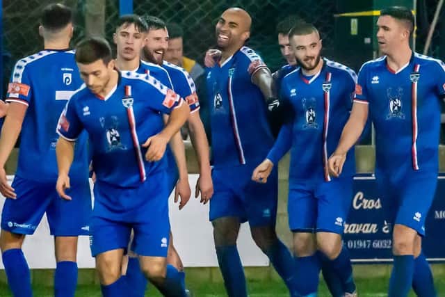 Jacob Hazel celebrates his second goal of the game with his Whitby Town teammates in the 3-0 home win against Grantham Town in the NPL Premier Division match.