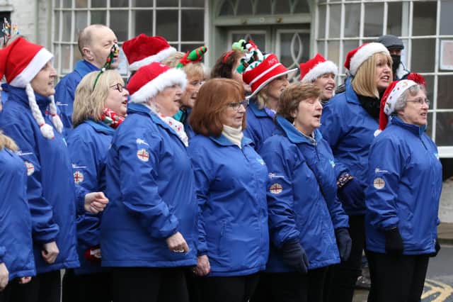 The Coastal Voices choir entertains visitors at the Street Festival Day in Bridlington’s Old Town. Image by TCF Photography