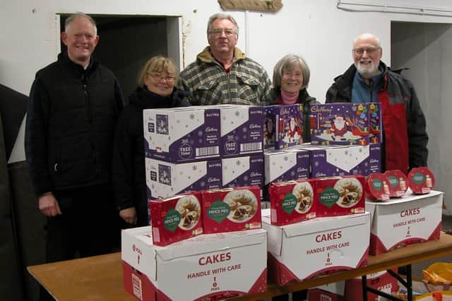 Whitby Lions Paul Freestone and Shirley Smith with Whitby Food Bank organisers John Woolin, Elizabeth Norval and Chris Taylor.