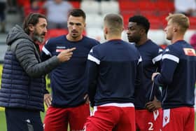 Boro boss Jono Greening puts his point across to his players before kick-off.