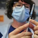 A nurse in Scarborough borough prepares to give a Covid vaccination.