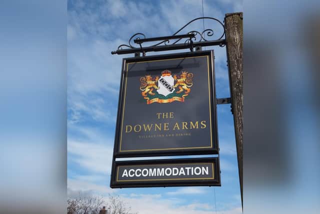 Pub sign at The Downe Arms, Castleton.