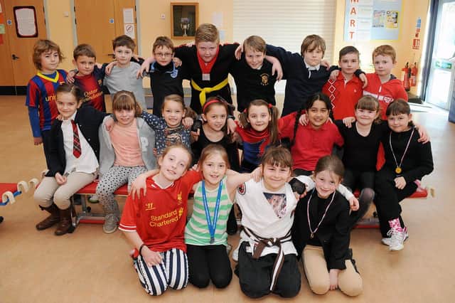 Bempton School pupils pose for the photographer during a Sport Relief event in 2014 – a scrum down for charity. Do you recognise any of the people in the picture? (NBFP PA1412-14a)