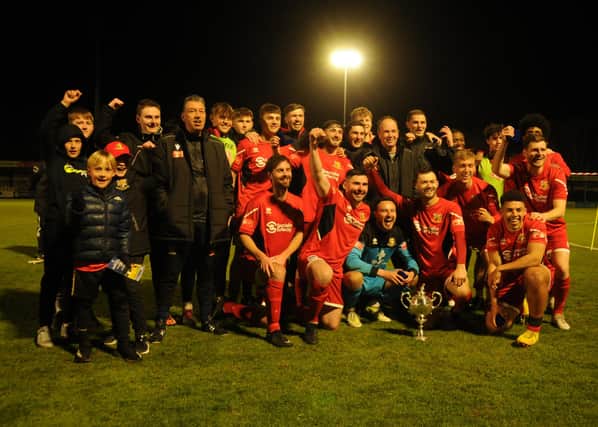 Bridlington Town celebrate their East Riding FA Senior Cup final win against North Ferriby on Tuesday evening. PHOTOS BY DOM TAYLOR