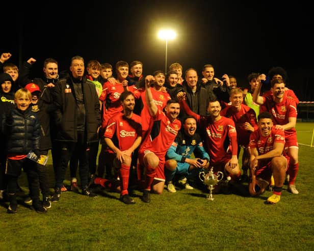 Bridlington Town celebrate their East Riding FA Senior Cup final win against North Ferriby on Tuesday evening. PHOTOS BY DOM TAYLOR