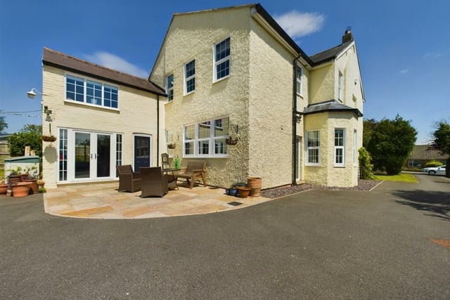 A view of the rear of the house, with patio area.