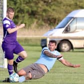 Brid Rovers Millau slide in for a challenge during their 4-2 friendly loss against Brid Spa. PHOTOS BY TCF PHOTOGRAPHY