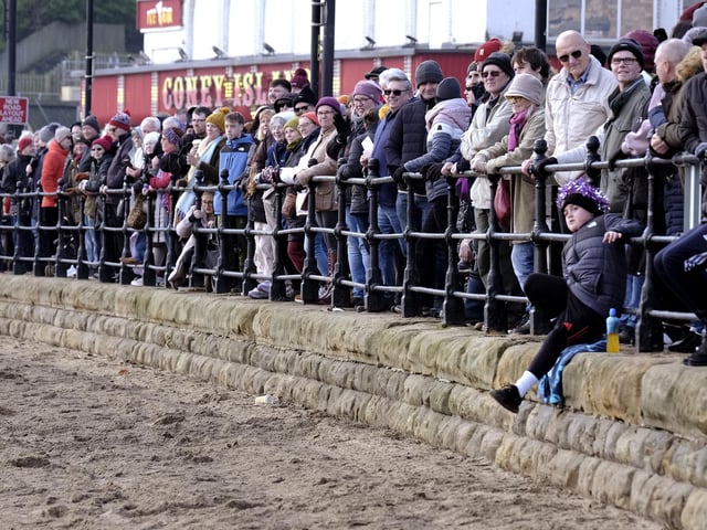 Crowds gather to watch the game