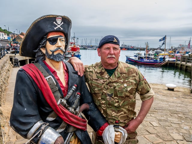 Sgt Ian McIntosh of Royal Artillery Regiment (Thirsk) next to a pirate figure down by the harbour.