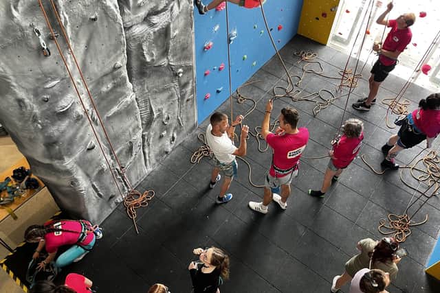 People preparing to take on the climbing wall at Street Rocks, Scarborough.