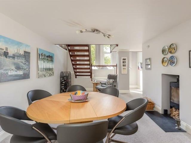 Dining space with a cosy logburner.