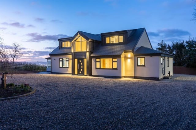 The front aspect of the attractive property, with a turning circle.