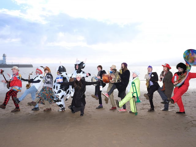 The Comic Band play on the beach