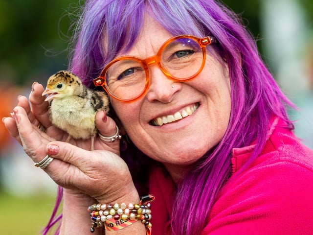 Deb Howe, owner of Eggucation, based near Sheffield, holding a one day old Bronze Turkey Poult