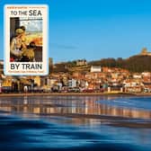 The front cover of To The Sea by Train with background picture of Scarborough seafront by James Hardisty.