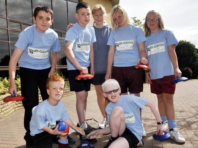 The Graham School Curling and Boccia team with their trophy from the North Yorkshire Youth Games, front from left: Jordan Kelly and Charlie Woodhead; back from left: Adam Duncan, Jed Owen, teacher Sue Flinton, Shannon Best and Zoe Bushby. Missing from picture: Lucy Debenham of St Augustine's. 102903